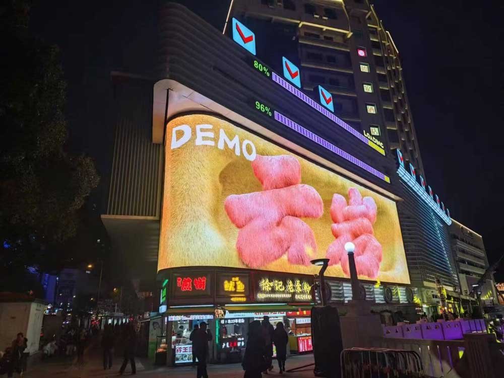 Outdoor commercial façade LED display at night