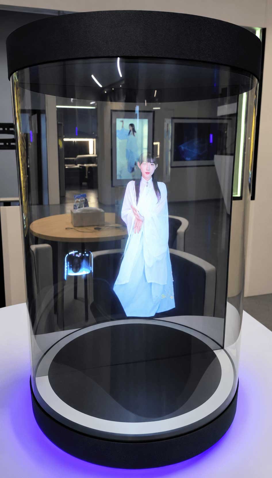 Illustrative 21.5-inch holographic cylinder display with a virtual cultural guide