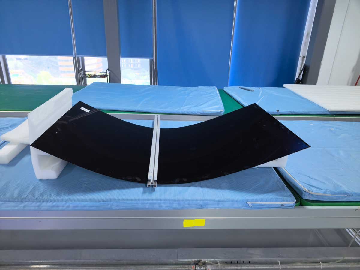 55-inch flexible OLED panel undergoing a controlled bending test