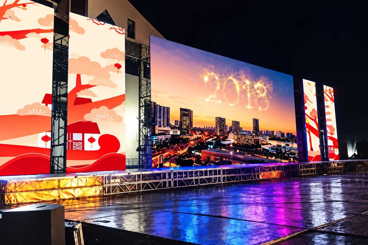 Outdoor festival stage with large LED screens