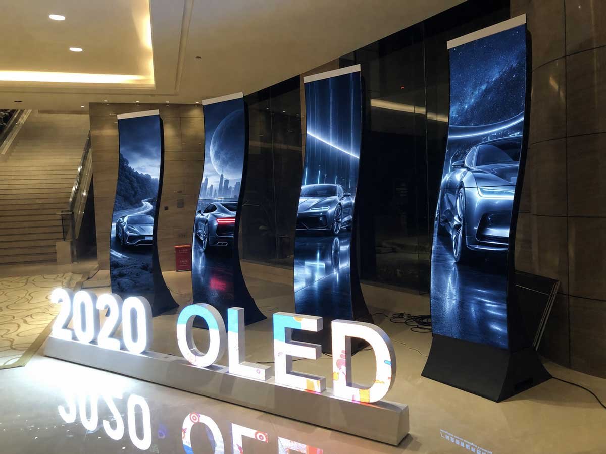 55-inch S-shaped flexible OLED displays showing automotive promotional content